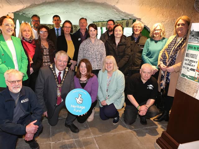 The Mayor of the Causeway Coast and Glens, Cllr Ivor Wallace, councillors Cara McShane and Cllr Margaret-Anne McKillop, and council staff, with Stella Byrne from The National Lottery Heritage Fund, and members of the Friends of Ballycastle Museum.