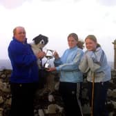 Pictured at the end of June 2002 are Natasha and Zowie Maguire who are seen presenting Willard Smyth, from Downhill Sheepdog Society, with a cup in memory of their late mother, Rosealeen Maguire. The cup was competed for in the novice section at the Downhill trials which were held on Saturday, July 6, 2002. Picture: News Letter archives/Kevin McAuley