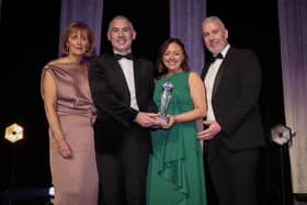 Anne McMullan, director of marketing and communications at Visit Belfast, presents the Tourism and Hospitality Company of the Year award to Lough Erne Resort’s Jonathan Gallagher, director of marketing; Lydia Woods, sales and events manager; and Barry McCauley, director of Golf at the AIB BusinessEye Awards.