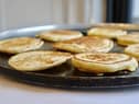 Here in Northern Ireland a pancake usually means a drop scone where a thick batter is dropped onto a griddle and flipped over. In England the word normally refers to a French style crepe which is much thinner
