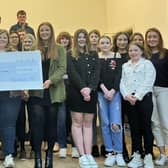 Kevin Doherty, Rural Support CEO, receiving a cheque from Holestone YFC for their fundraising efforts towards Rural Support’s Life Beyond Bereavement Programme. (Pic: Rural Support)