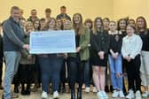 Kevin Doherty, Rural Support CEO, receiving a cheque from Holestone YFC for their fundraising efforts towards Rural Support’s Life Beyond Bereavement Programme. (Pic: Rural Support)