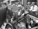 Pictured in May 1992 amidst the hustle and bustle of the Ballyclare May Fair is horse dealer George Rainey from Drumbeg, Lisburn, who is seen relaxing from his toil on the back of a convenient cart and as he watches the world go by. Picture: News Letter archives/Darryl Armitage