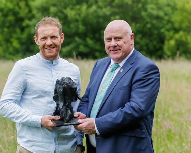 Overall winner of the 2025 Pasture Progress Awards, Co Wexford farmer Liam Rochford, receiving his award from Minister of State at the Department of Agriculture, Food and the Marine, Noel Grealish, TD.
