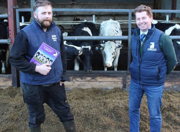 Ai Services' Gary Henderson (right) congratulating Co Londonderry dairy farmer Scott Thompson on winning the opportunity to take part in a study trip to Denmark later this year