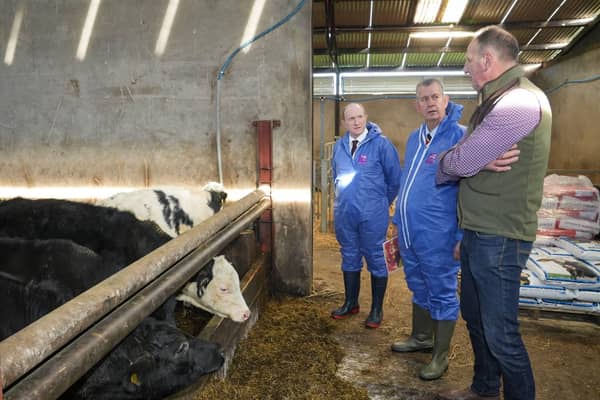 Minister Poots is pictured with (left to right) Dr Sam Strain, Chief Executive of AHWNI and farmer Mr Brian Cromie.