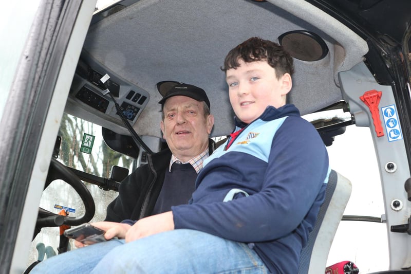 Archie and Scott Graham pictured at the Bushmills Presbyterian Church tractor run on Saturday. (PICTURE KEVIN MCAULEY/MCAULEY MULTIMEDIA)