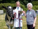 Grace Elwood and her British Blue Heifer wining the Cecil and Molly Robinson Perpetual Cup for best young handler in the beef section at this year’s Castlewellan Show, presented by show vice president Molly Robinson.