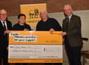 Jim Quail, Club President, Ian Davidson Snr and Brian McAuley, Club Chairman presented a cheque for £22,000 to Mary MacFarlane of the Cystic Fibrosis Trust at the Clubs AGM.