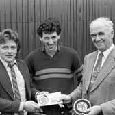 Pictured in October 1981 is Mr J Hill, manager of the Ballymena branch of the Northern Bank, handing over championship cheques to John Harkin (supreme champion) and John Conway (reserve supreme champion) at a show and sale of pedigree Blackface ram lambs at Ballymena. Picture: News Letter archives/Darryl Armitage