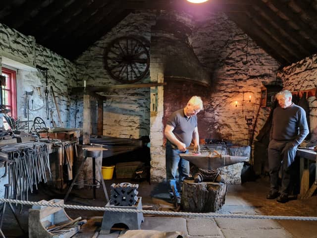 A blacksmith at work in  Lisrace Forge at the Ulster Folk and Transport Museum at Cultra, Holywood during the museum's annual Country Skills Day. Picture: Darryl Armitage