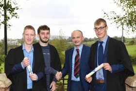 Matthew Graham, Fivemiletown, Ryan Elliott, Tempo, and Angus Elliott, Ballinamallard were congratulated on achieving their Level 2 Diploma in Work-based Agriculture by Philip Holdsworth (Senior Lecturer, CAFRE). The students completed their course over two years of part-time study completing the Apprenticeship programme at Enniskillen Campus and marked their achievement at the autumn Graduation Ceremony at the campus. (Pic: CAFRE)
