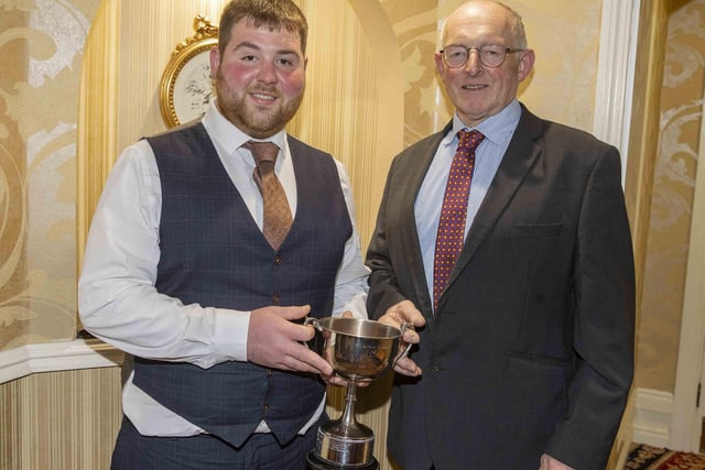 President’s Medal nominee John McLean, Bushmills, received the Automart Trophy from Holstein UK chairman Michael Smale. Picture: Kevin McAuley/McAuley Multimedia