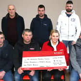 Caroline Smith receiving the cheque from club members