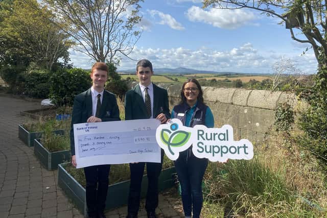 Frank Hanna and Edward McKay along with Hannah Kirkpatrick Rural Support accepting the cheque. (Pic: Rural Support)