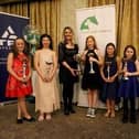 Bree Rutledge presented the Balmoral Under 10s winner Chloe Clarke and all qualified participants with their awards. (Pic: SJI Ulster Region)