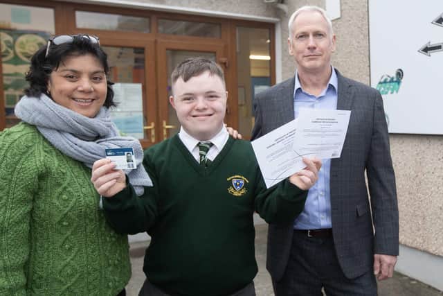 Pictured with Séan at Gairmscoil Mhic Diarmada School as he proudly shows off his qualifications  are his teacher teacher, Florence Calais and Garvan Meehan, Principal of the National Fisheries College of Ireland in Greencastle, Co. Donegal. (Photo Brian Farrell)