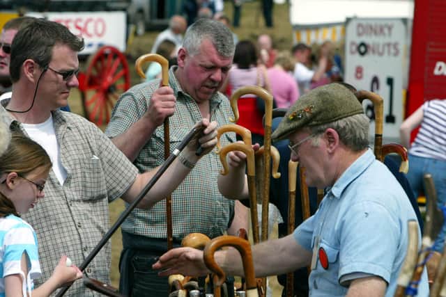 Taking stick was on the mind of these buyers at the Castlewellan Show in July 2002. Picture: News Letter archives/Gavan Caldwell