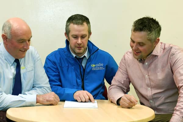 Robin Bolton and Leigh McClean CAFRE discussing the final 2024 NRoSo sprayer operators roadshow with Chris Gill, UFU.