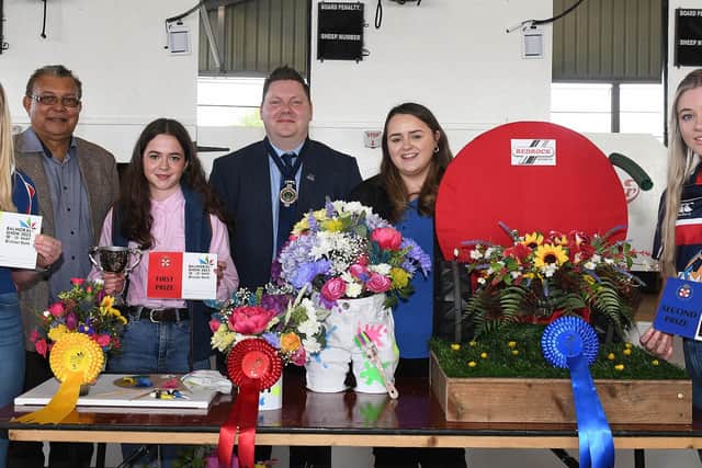 Members who won the 12-14 section in the floral art competition with judge, Gregory Baptie (left), YFCU president, Stuart Mills (centre), Kerri Ann Curran, Power NI (centre left)