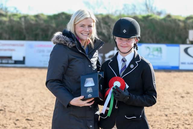 Sophia Medely riding Bainrion Alainn, joint winner of the combination most supporting the League, presented by Christine McBride