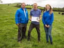John Milligan, a beef farmer from Castlewellan, with Andrew Thompson (CAFRE) and Emma Neville (CAFRE) reviewing SNHS Soil Analysis results in preparation for TDF event on Tuesday 26 September.