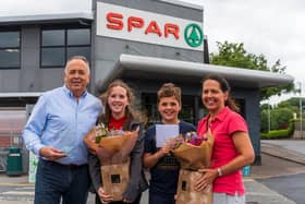 Peter McBride with his daughter and son, Ava McBride and Ben McBride and his wife, Julie McBride, celebrating Peter’s successful 35 years in business. Pic: Jcomms