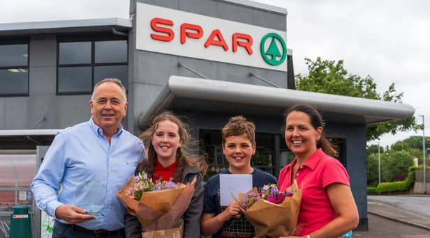 Peter McBride with his daughter and son, Ava McBride and Ben McBride and his wife, Julie McBride, celebrating Peter’s successful 35 years in business. Pic: Jcomms