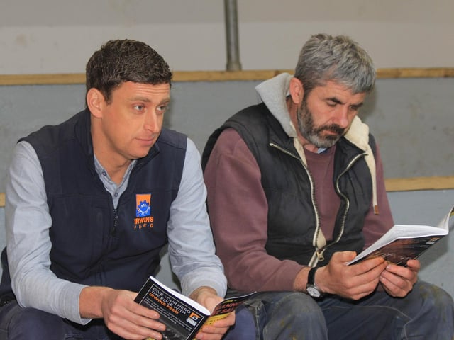Sponsor Andrew West, Irwins Feed, and Pomeroy dairy farmer Samuel Moore keep an eye on trade at Dungannon. Picture: Julie Hazelton