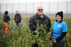 Pictured among some of the trees growing in the prison are Malcolm McClenaghan, Governor in charge of Activities, and Aisling Gribbin from the Causeway Coast and Glens Heritage Trust
