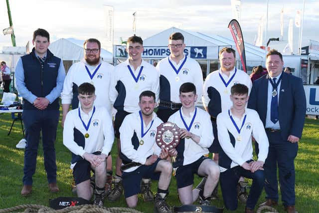 Tug of war novice winners, Trillick and District YFC with John Thompson and Sons representative, Nathan Harvey and YFCU president, Stuart Mills