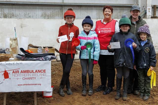 Margretta Chambers from Air Ambulance NI presenting the prizes to the winners in the xpoles/40cms class.  Also in the photo is Ruth Baird from the Gamekeepers Lodge.