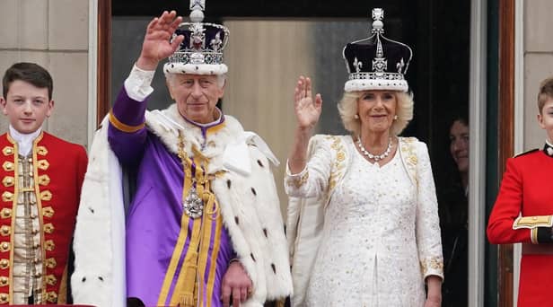 King Charles III and Queen Camilla on the balcony of Buckingham Palace following the coronation on May 6, 2023. Picture: Owen Humphreys/PA Wire.