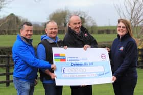 Killead Ploughing Society members Mark Roundtree, secretary; Alan Wallace, treasurer; and William Johnston, chairman, present a cheque for £1,000 to Jacqui McCurdy, Dementia NI. Picture: Julie Hazelton