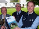 Stephen Shanks, right, Genus ABS, discusses sponsorship of Holstein NI’s forthcoming bull sale at Kilrea, with John McIlrath, HA McIlrath and Sons, Kilrea; and Holstein NI president David Perry. Photograph: Columba O'Hare/ Newry.ie