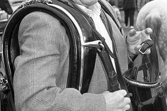 Pictured at the end of September 1992 at the Dromore Horse Fair is Robert Murray from Sandy Row, Belfast, selling horse harnesses during the fair. Picture: News Letter archives/Darryl Armitage