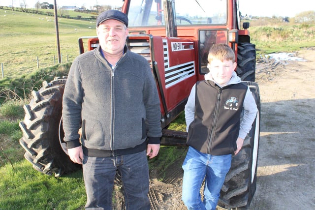 Geoffrey Irvine and Will Bingham support the tractor run for Cancer Research.
