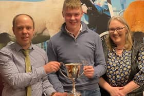 Thomas and Orla McAlister receiving the Synton cup for the Champion Gimmer at the Premiere Sale, from Chairman Allister McNeill.