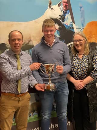 Thomas and Orla McAlister receiving the Synton cup for the Champion Gimmer at the Premiere Sale, from Chairman Allister McNeill.
