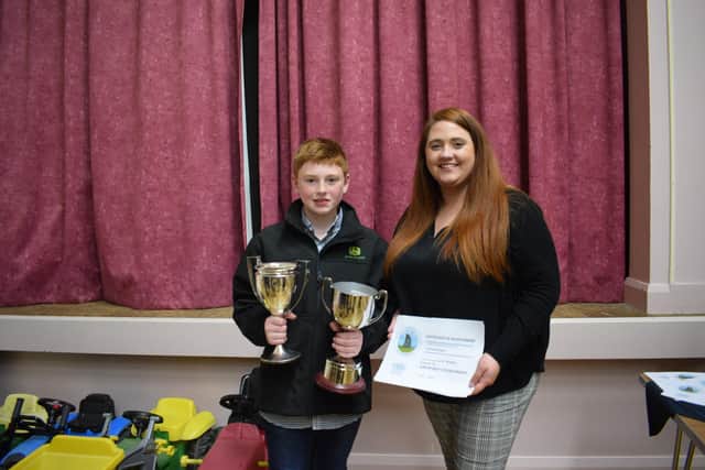 Charlie McKnight receiving his awards from Shannen Vance