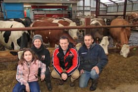 The Leathem family, David, Kirsty and daughter Beckie, from Moira have recently diversified from suckler farming to dairying.  They are pictured discussing the forthcoming open day on 26th April with Tommy Armstrong, Lely Center Eglish. Picture: Julie Hazelton