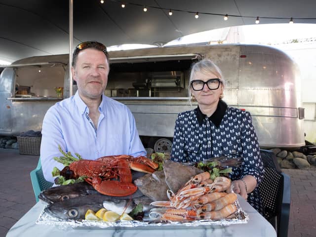 Robert and Elaine Hayes, owners of seafood business Naughton’s Yard in Kilkee with their vintage 1968 American Airstream trailer which has been converted into a food truck