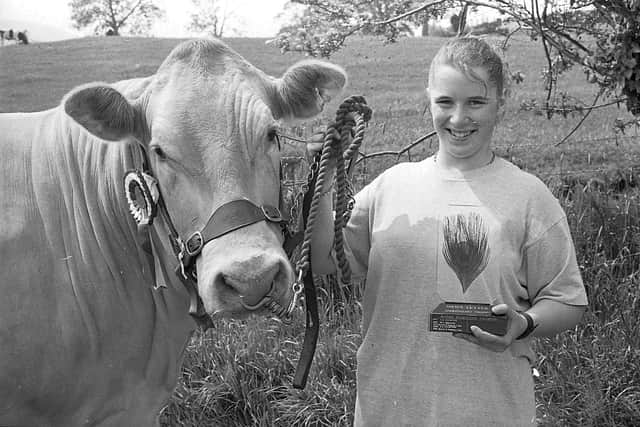 Pictured at the Newry Show in June 1992 is Leanne Rodgers from Ballynahinch who is seen proudly showing off the News Letter trophy that she received after her animal won the Blonde d’Aquitaine Championship at the show. Picture: News Letter archives/Darryl Armitage