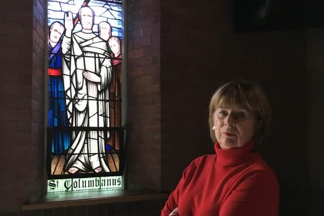 Deborah Girvan, chairwoman of Friends of Columbanus Bangor, with the Columbanus Window