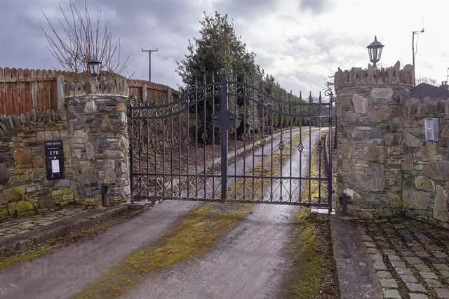 The site is approached via rustic stone pillars and electric gates. Image: www.peterfitzpatrick.co.uk
