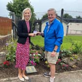 Carla Lockhart with Don Corkin local man in Avenue Road who plants out areas or land in the estate. Pic: DUP