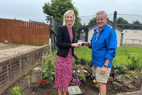 Carla Lockhart with Don Corkin local man in Avenue Road who plants out areas or land in the estate. Pic: DUP
