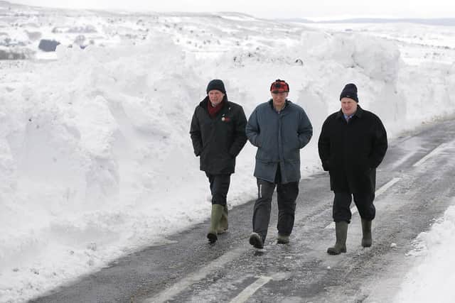 Back in time: Barclay Bell, Campbell Tweed and Harry Sinclair during severe weather 2013.