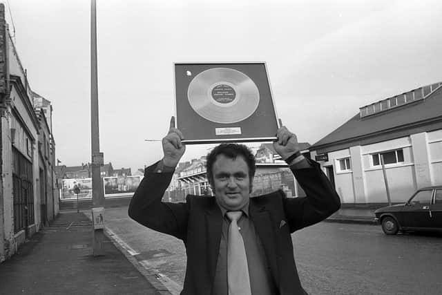 Pictured in January 1983 is ‘Ireland’s singing farmer’, John Watt from Armoy, Co Antrim, holding aloft his silver disc, which had been presented to him after sales of 16,000 albums and cassettes. The News Letter noted: “The Armoy farmer writes most of his own songs and has proved to be a popular performer at county and western music shows across the province.” Picture: News Letter archives