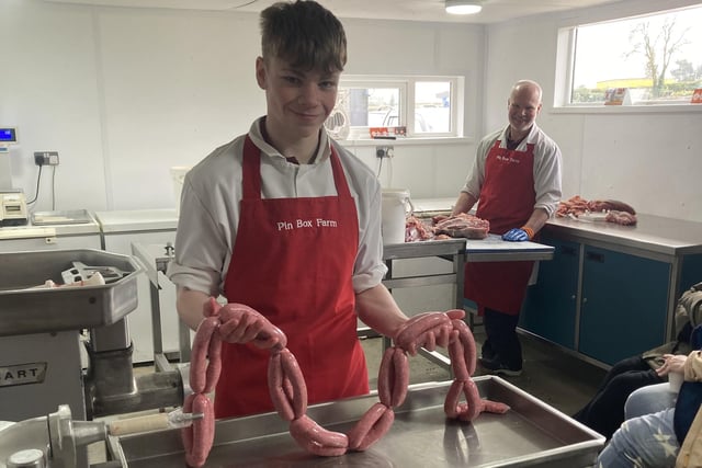 Jacob Neill showcases his sausage linking skills.
